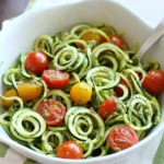 Raw Spiralized Zucchini Noodles with Tomatoes and Pesto