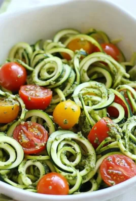 Raw Spiralized Zucchini Noodles with Tomatoes and Pesto